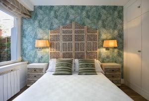 En eller flere senge i et værelse på Oasis Madrid - Private Garden - Near Bernabéu