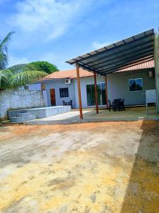 a house with a patio with a roof at Alter do Chão Casa 02 in Alter do Chao