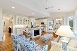 a living room with a couch and a table at MH3012: 3012 Marsh Haven in Seabrook Island