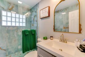 a bathroom with a sink and a shower at Boat Dock and Patio Canal-Front St James City Home! in Saint James City +24 photos