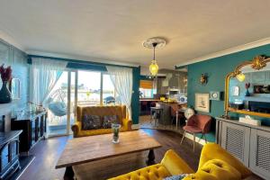 a living room with a couch and a table at Dog-friendly Seaview Apartment in Dungarvan