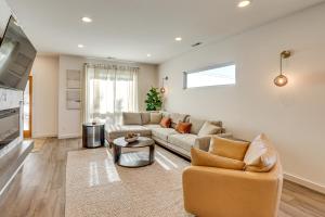a living room with a couch and a table at 4 Mi to Dtwn Greenville Group-Ready Home with Yard in Piedmont Park