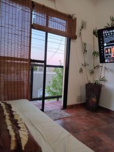 Postel nebo postele na pokoji v ubytování Alojamiento Las Camelias