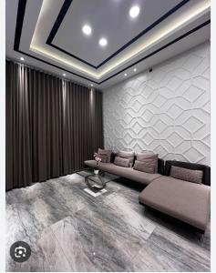 a living room with two couches and a couch at Konohagakure in Jakarta