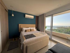 Postel nebo postele na pokoji v ubytování Santa Marta apartamento frente al mar -Santamarina- 1802