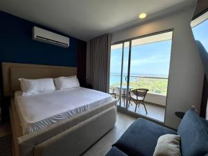 Postel nebo postele na pokoji v ubytování Santa Marta apartamento frente al mar -Santamarina- 1802 + 3 fotografie