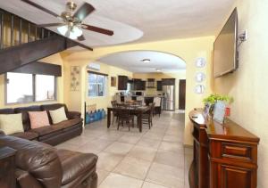 a living room with a couch and a dining room at Rocky Point Casa Mango w Pool Walk to Beach in Ciudad Constitución