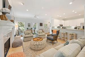 a living room with a couch and a table at OG23: 23 Ocean Green in Kiawah Island