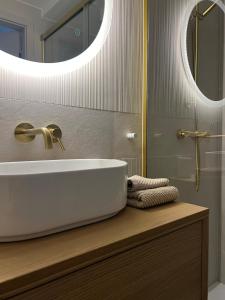 Ένα μπάνιο στο Rosette Residence 25 z bezpłatnym parkingiem