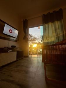 TV a/nebo společenská místnost v ubytování vista mar e por do sol- morro de sao paulo