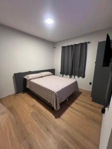 Ένα ή περισσότερα κρεβάτια σε δωμάτιο στο Esquina 8 Apart-Hotel