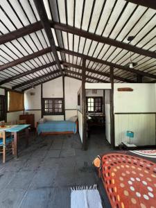 a room with a bed and a table in it at Galilea in San Miguel del Monte