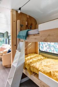 a bunk bed in a tiny house at Magic Bus on river w/hot tub at Smuggler's Notch in Morses Mill