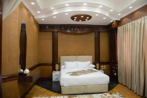 a bedroom with a large bed in a room at lotus view El tahrir in Cairo