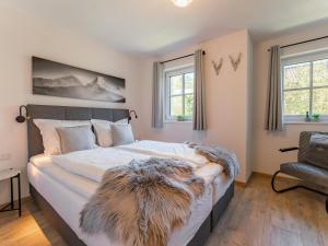 Ένα ή περισσότερα κρεβάτια σε δωμάτιο στο Tauernlodge Berglust