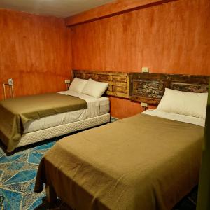 Postel nebo postele na pokoji v ubytování Xelva Hostel & Travel community