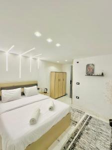 Ένα ή περισσότερα κρεβάτια σε δωμάτιο στο boulevard Pyramids view inn