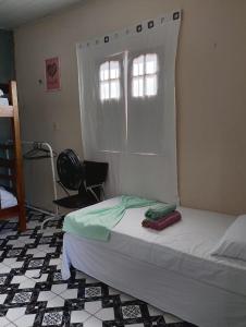 En eller flere senge i et værelse på Kit Net moderna para COP 30 + 2 billeder