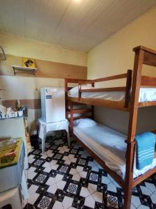 En eller flere senge i et værelse på Kit Net moderna para COP 30