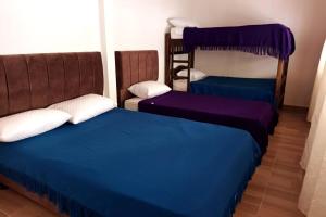 Ένα ή περισσότερα κρεβάτια σε δωμάτιο στο Cabaña Villa de Leyva - Villa Sofia Ritoque #2