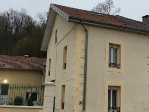 a white building with a brown roof at Charmant Gîte au Cœur de Velle-sur-Moselle, Proche Nancy et Lunéville, Terrasse Privative - FR-1-584-178 in Velle-sur-Moselle