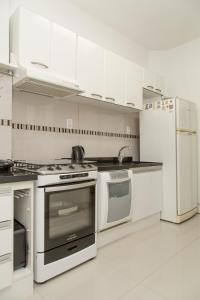 Una cocina o zona de cocina en Apartamento Redenção