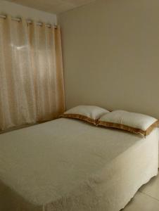 Postel nebo postele na pokoji v ubytování Aconchego do sertão