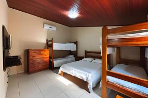 Ένα ή περισσότερα κρεβάτια σε δωμάτιο στο Casa com piscina no coração de Bonito/ até 12 pess +36 φωτογραφίες