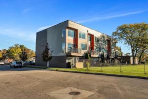 a building with a car parked in front of it at Cozy Birmingham Retreat in Birmingham