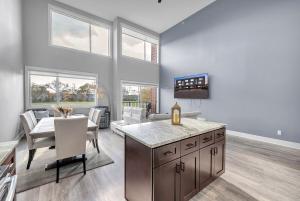 a kitchen and dining room with a table and chairs at Cozy Birmingham Retreat in Birmingham