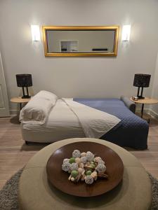 a bedroom with a bed with a mirror and a table at Modern ranch retreat near Trilith and US Soccer Training Facilities in Fayetteville