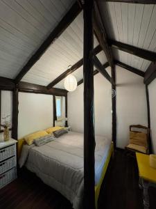 a bedroom with a large bed in a room at Galilea in San Miguel del Monte
