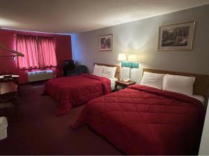 Postel nebo postele na pokoji v ubytování Astoria inn