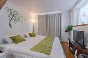 Ένα ή περισσότερα κρεβάτια σε δωμάτιο στο Chihaya Relaxation Haven +17 φωτογραφίες