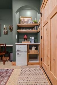 a kitchen with a white refrigerator in a room at Sommer House Inn-Woodland Room in Jasper