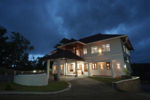 a house at night with its lights on at Winspark Inn Resort in Varkala
