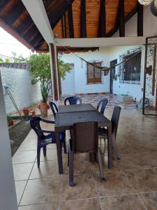 a black table and chairs on a patio at Casa Bella in Rivera