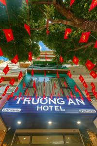 a building with red flags hanging from the ceiling at Trường An Hotel in Cao Bằng