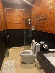 a bathroom with a toilet and a shower and a sink at Evergreen2 เอเวอร์กรีนทู in Ban Pok Nai +23 photos