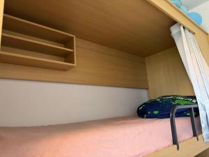 a bunk bed with a backpack sitting on top of it at AECOspires CoWorkStel in Munich