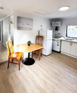 a kitchen and dining room with a table and chairs at Charlestown Central 7 Bedrooms Front House and Back Unit in Charlestown