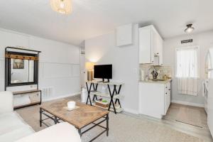 a living room with a couch and a table at Downtown location Near the Beach Dog Friendly in Edmonds