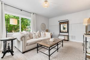a living room with a couch and a table at Downtown location Near the Beach Dog Friendly in Edmonds