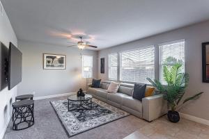 a living room with a couch and a table at Nic's Home in Visalia