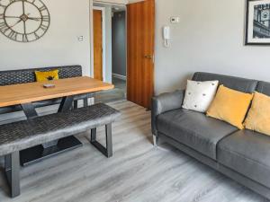 a living room with a couch and a table at The Hive in Newcastle upon Tyne