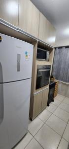 Kuchyň nebo kuchyňský kout v ubytování Aconchego da Kelen