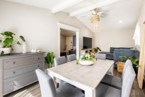 a dining room and living room with a table and chairs at Private Pool, Hot Tub & Game Room Retreat in Jacksonville