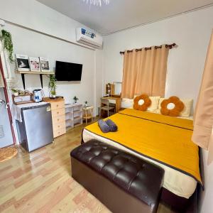 a bedroom with a large bed with two teddy bears on it at Lee Red House in Ban Lak Uan +113 photos