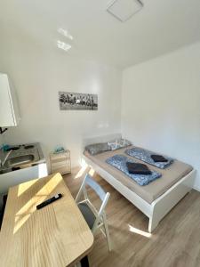 Postel nebo postele na pokoji v ubytování City Suites - Vienna North - Free Parking