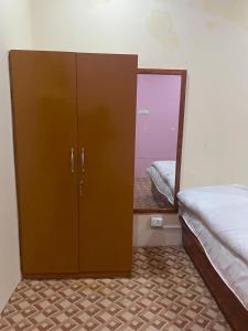 Ένα ή περισσότερα κρεβάτια σε δωμάτιο στο Hills Weather Homestay